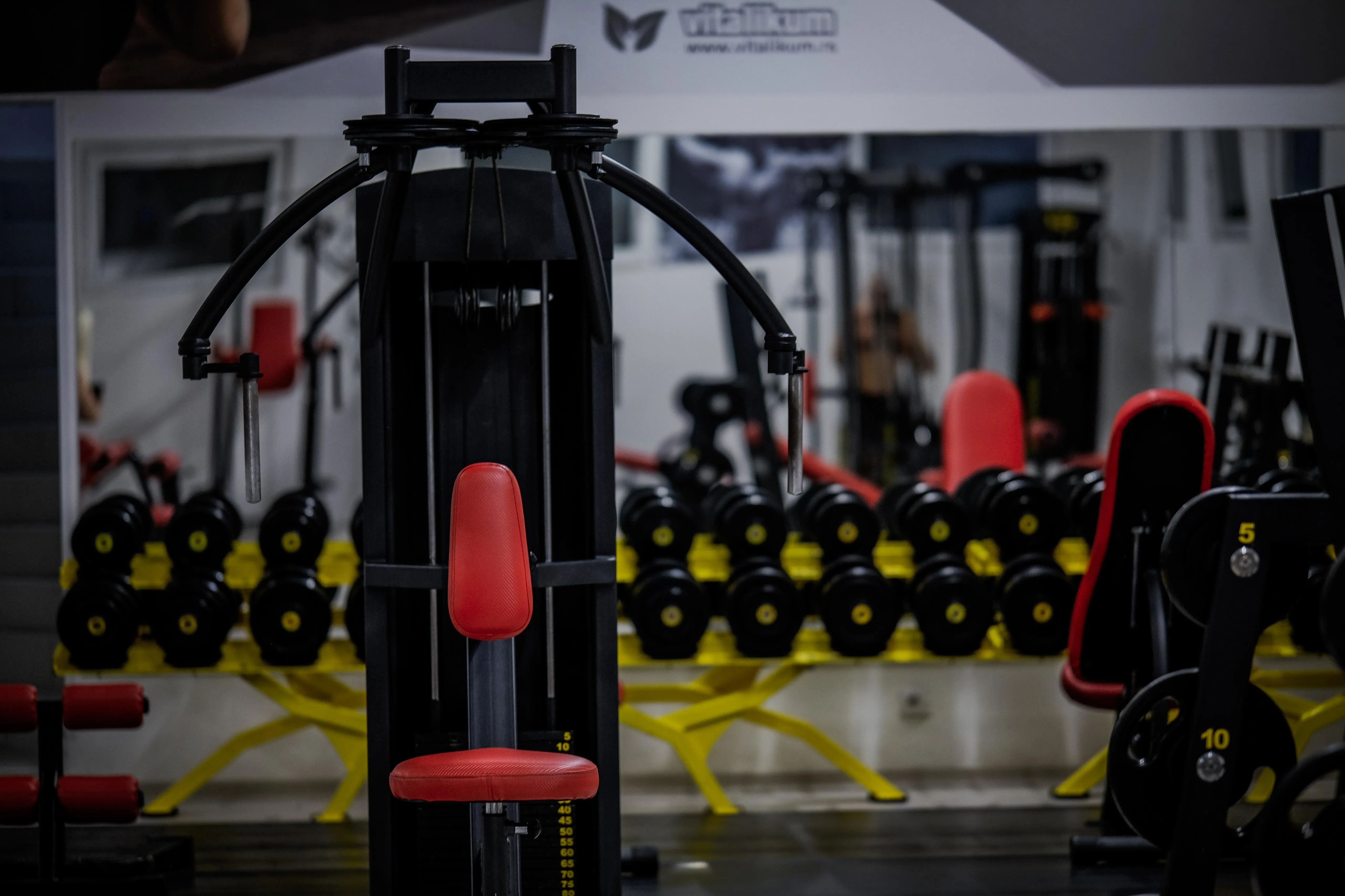 Dumbell rack with other equipment in the vicinity.