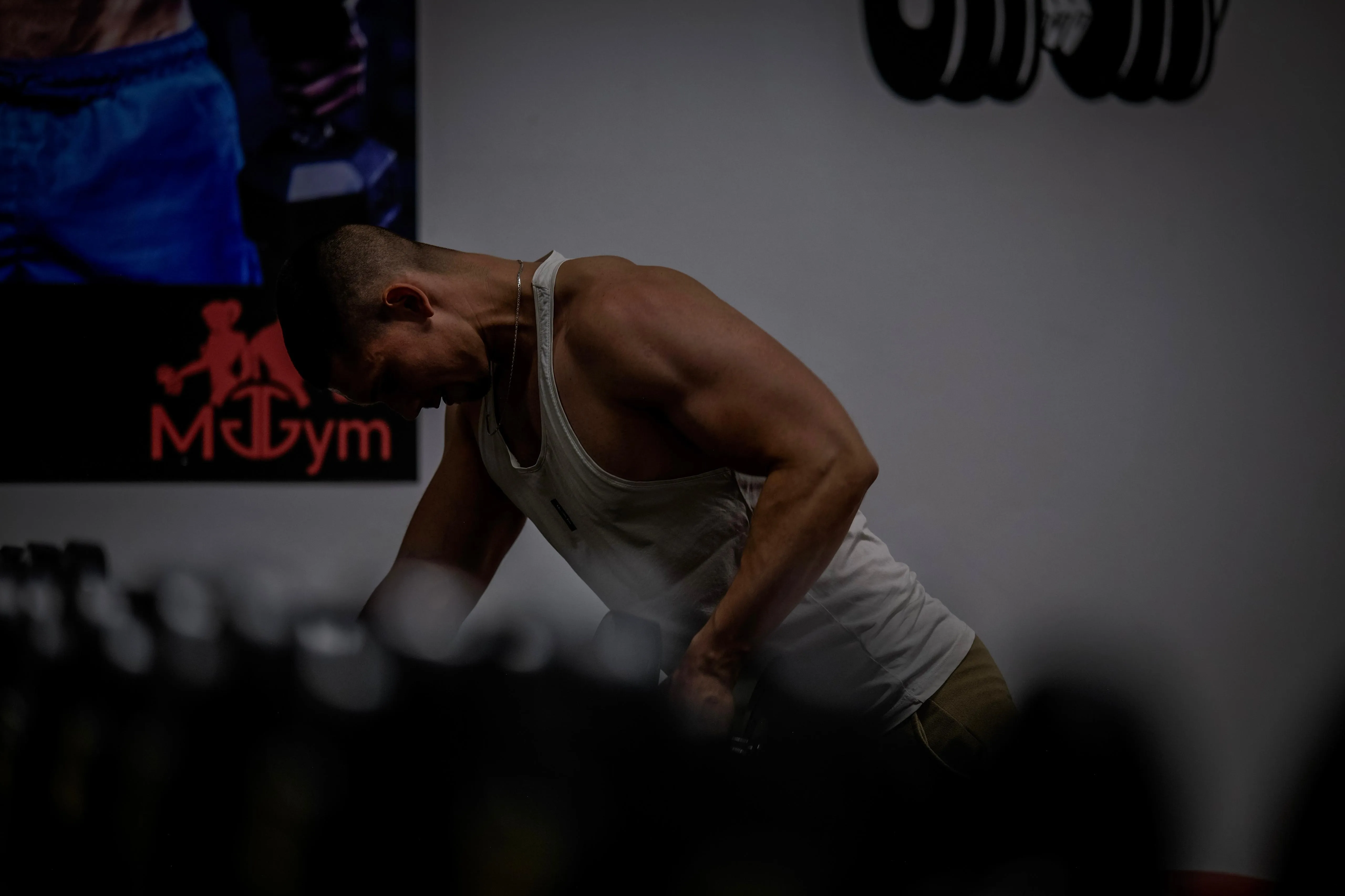Man doing dumbell row exercise.